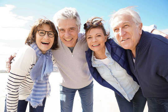 Portrait of cheerful senior people having fun on vacation
