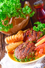 grilled bullets with croquettes and vegetables