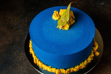 delicious blue cake decorated with dried pear