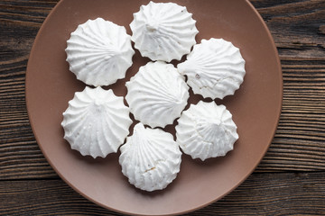 White zephyr marshmallow on porcelain plate