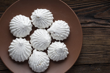 White zephyr marshmallow on porcelain plate