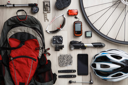 Wheel, steering wheel, seat, helmet, tire, sunglasses, reflective tape, backpack.
