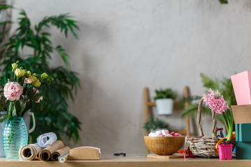 Picture of florist's room with vase of flowers, marshmallow