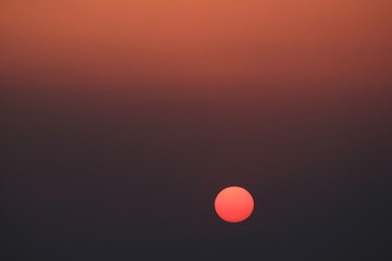 Sunset view from Laurebina, Langtang National Park, Nepal. Sun shining trough thick mist.