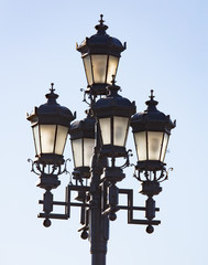 Ancient street lamp on the sky background