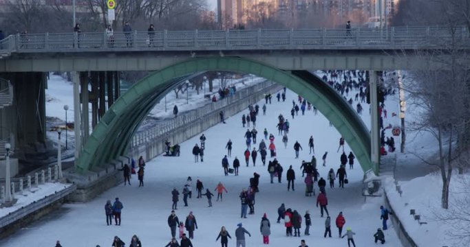 Tourists skating on rideau canal  during sunset -Ottawa Ontario Canada February 18th 2018