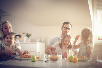 Obraz na płótnie Canvas Big family having breakfast together.