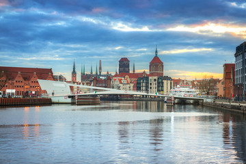 Fototapeta premium Old town of Gdansk reflected in Motlawa river at sunset, Poland