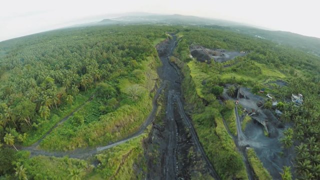 Aerial photography of volcanic outflowing river for ash. Legazpi city. The Mayon Volcano. Philippines.