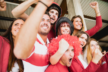 Football fans supporting their team at the arena for the world championship,