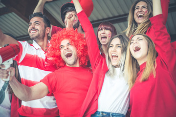 Football fans supporting their team at the arena for the world championship,