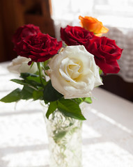 roses on   white table