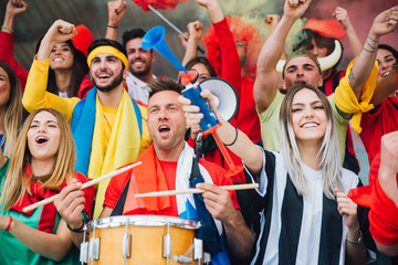 Football fans supporting their team at the arena for the world championship,