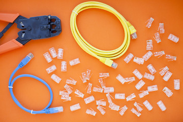 SKS and engineering concept. Set of connectors, ethernet and console cables, crimp tool on the...