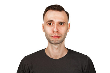 Unhappy, sad young man isolated on white. Bad emotion.