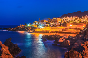 Obraz na płótnie Canvas Night scene over Santiago de Tenerife cityscape, illuminated architecture in evening, Canary island, Spain