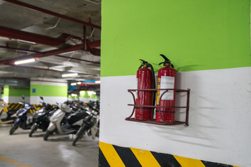 Fire extinguisher in underground basement motorbike parking