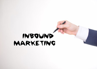 The businessman writes a black marker inscription:INBOUND MARKETING