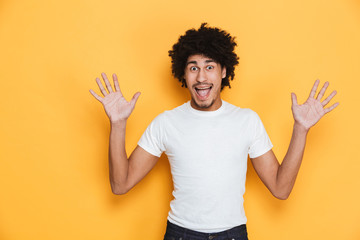 Portrait of an excited young african guy screaming