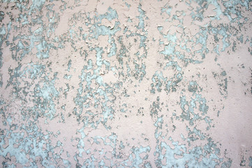 Weathered pink grey plaster wall texture background, close up
