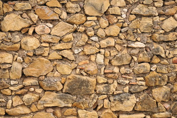 Textura de muro antiguo de piedra marrón