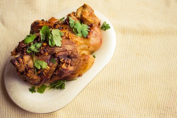 Appetizing meat on a white plate.