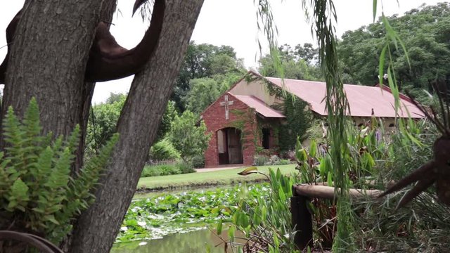 Wide of Church building seen from trees