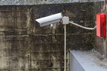 CCTV camera on a stone wall
