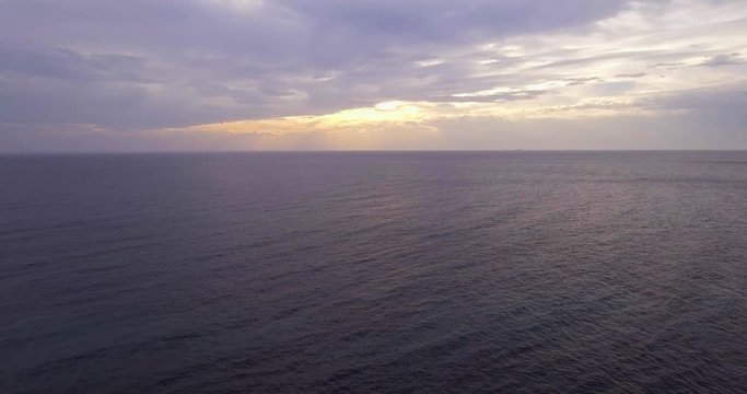 Aerial, beautiful calm sea in the evening and overcast sky