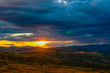 Naklejka na ściany i meble Mountain landscape with clouds. Mountain valley. The Altai mountains. Dramatic sunset in the mountains. Travel adventure vacation background