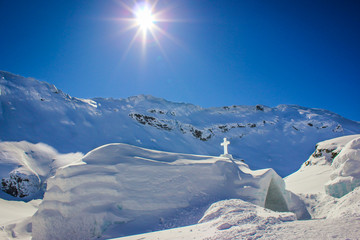 The ice church at Balea lake in Sibiu county, Romania with Fagaras Mountains in the background