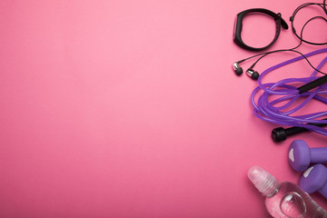 Sports accessories on a pink background with space for text.