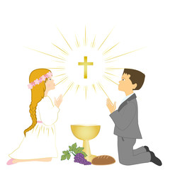 Boy and girl praying on knees and receives Eucharist.