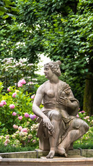 Fototapeta na wymiar Susannabrunnen (Susanna fountain) - statue of young half naked woman startled by someones presence while bathing. Created by Hans Waldburger, 1700. Mirabellgarten (Mirabell garden), Salzburg, Austria