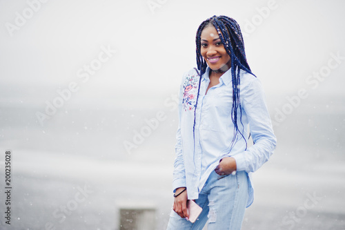 Stylish African American Girl With Dreads Holding Mobile