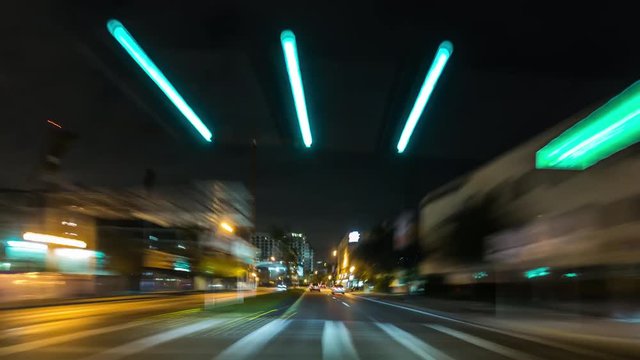 Night time car traffic time lapse. Driving through Miami streets, Florida. USA