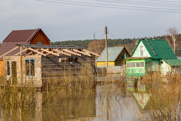 Flooded summer cottages and houses during the spring high water, April
