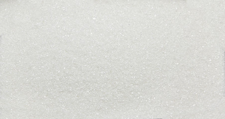 Heap of white sugar crystals - texture and details