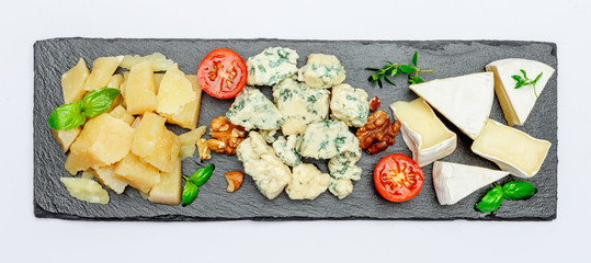 Cheese plate with Assorted cheeses Camembert, Brie, Parmesan blue cheese