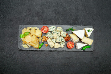Cheese plate with Assorted cheeses Camembert, Brie, Parmesan blue cheese