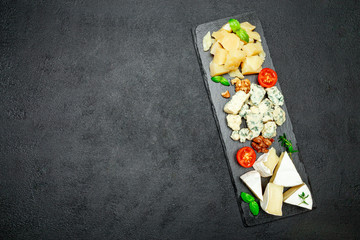 Cheese plate with Assorted cheeses Camembert, Brie, Parmesan blue cheese