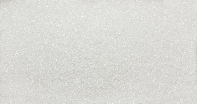 Heap of white sugar crystals - texture and details