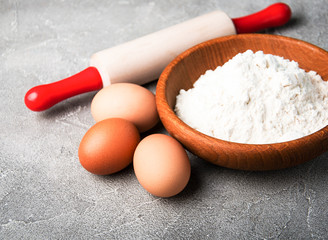 Fototapeta na wymiar Baking ingredients - flour, eggs and pin