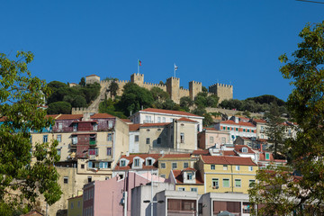 External View of Sao Jorge Castle in Lisbon and Colorful Houses Underneath it, Portugal