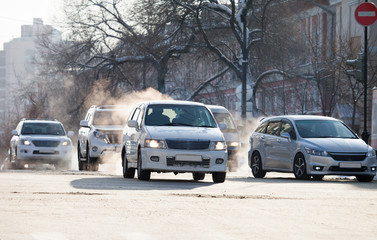 Cars on a crossroad in winter city