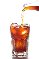 Pouring soft drink with ice cubeson white background