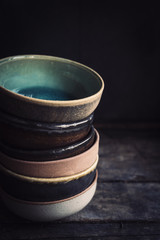 Craft maded dishes on wooden background with blank space,selective focus