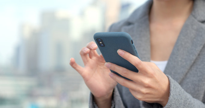 Business woman look at mobile phone