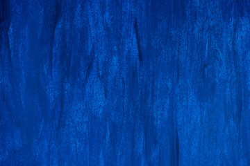 Dark blue and blue background smeared with brushes.