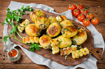Grilled potatoes stuffed with bacon and herbs